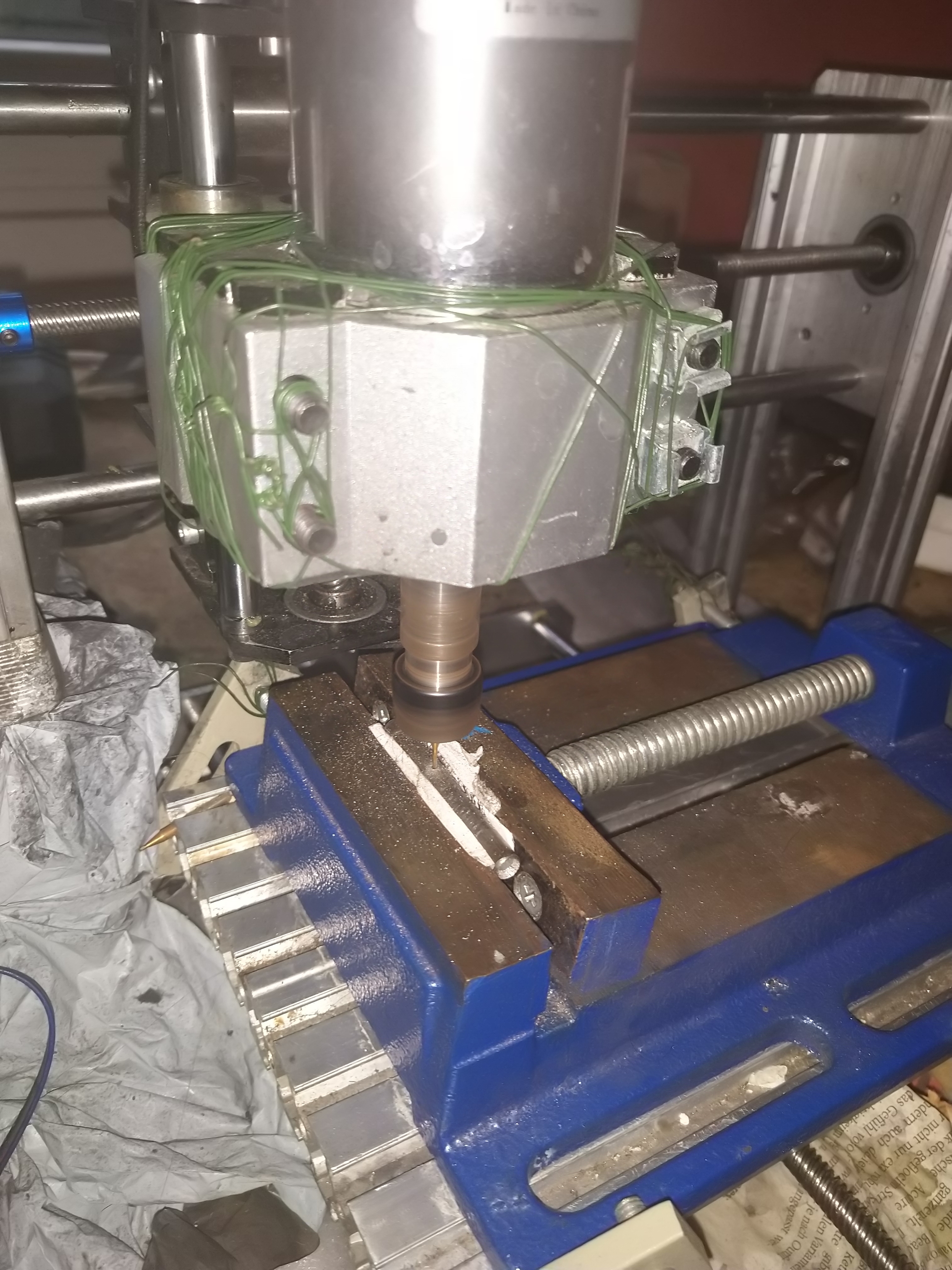 using CNC machine for drilling holes into titan tubes for arms